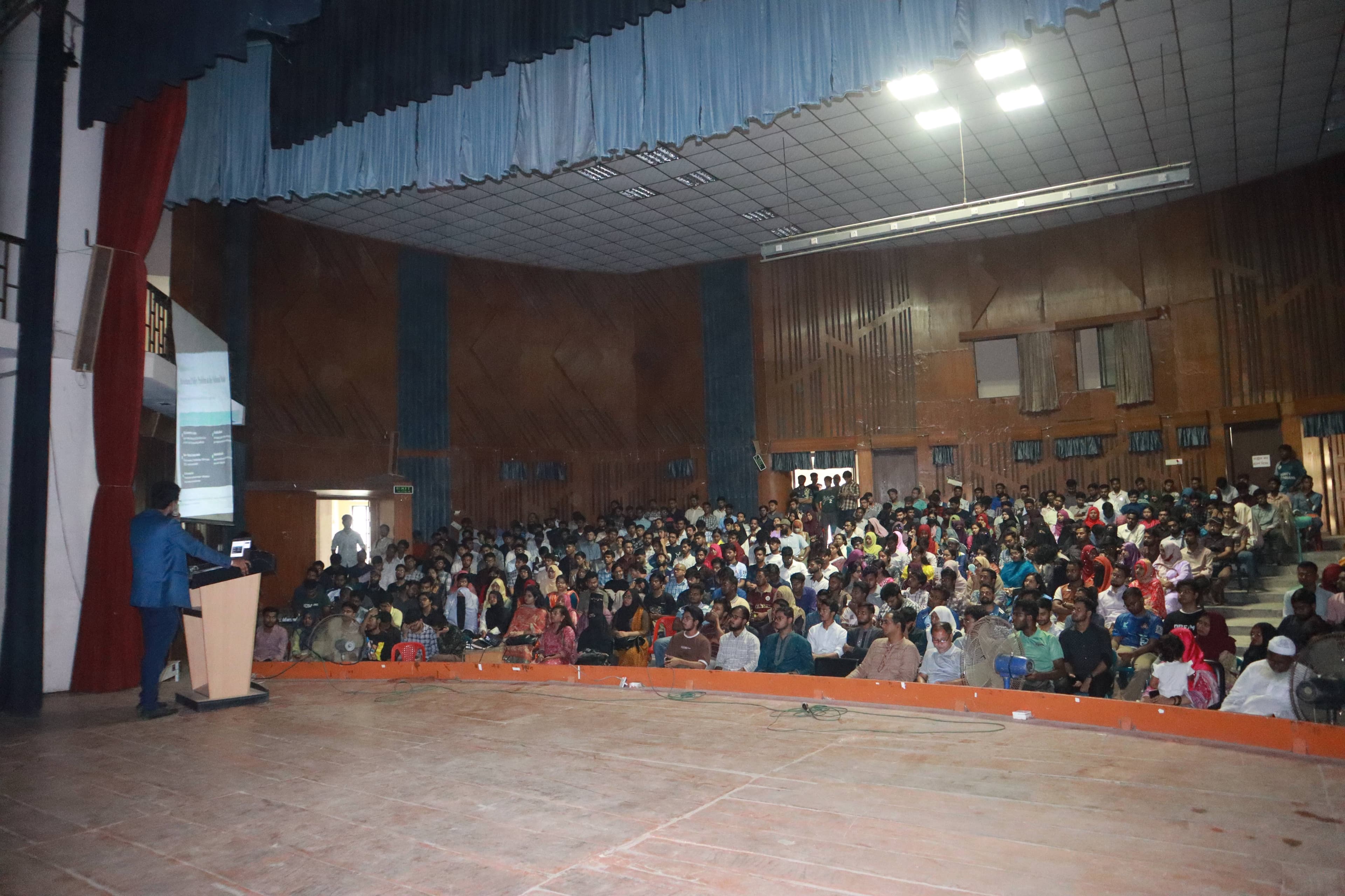 Group photo of guests, teachers, KRTC team, and students at the Rajshahi seminar
